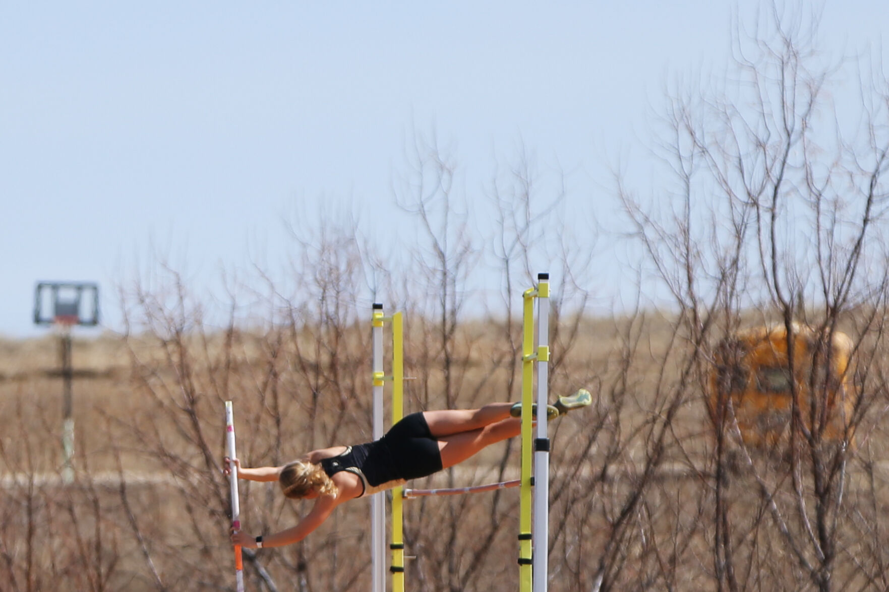 Sophie Berglund clears the bar during a pole vault jump